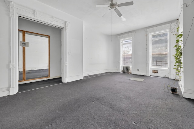 17 Palmetto St, Brooklyn, NY 11221 - carpeted empty room with a ceiling fan and radiator heating unit