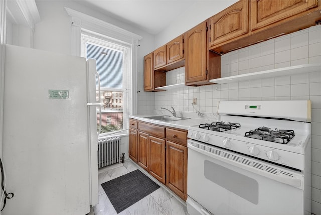 17 Palmetto St, Brooklyn, NY 11221 - kitchen featuring white appliances, radiator heating unit, light marble finish flooring, light countertops, and brown cabinetry