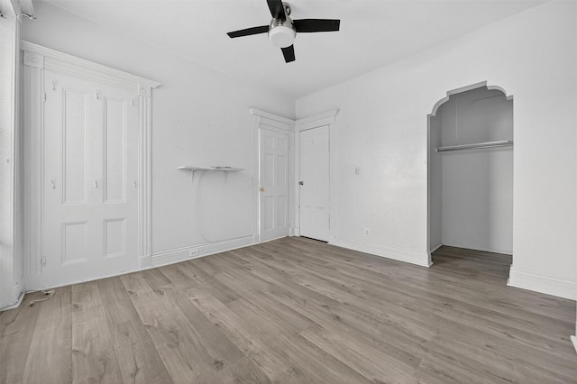 17 Palmetto St, Brooklyn, NY 11221 - unfurnished bedroom with wood finished floors, arched walkways, and ceiling fan
