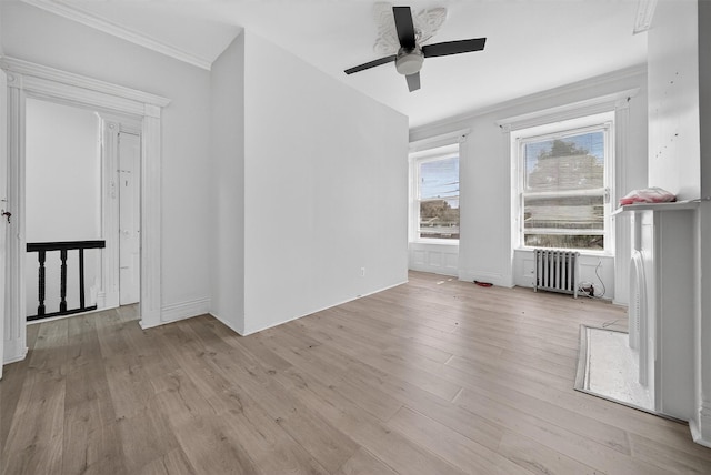17 Palmetto St, Brooklyn, NY 11221 - unfurnished living room featuring radiator, ceiling fan, light wood-style flooring, and crown molding