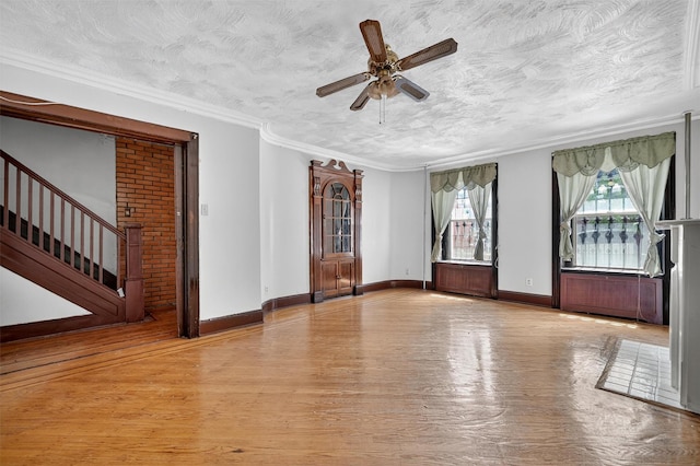17 Palmetto St, Brooklyn, NY 11221 - spare room with wood finished floors, ceiling fan, a textured ceiling, stairs, and ornamental molding