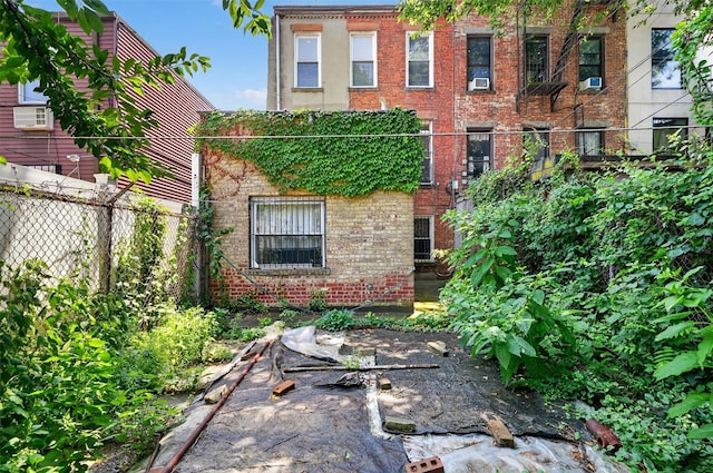 17 Palmetto St, Brooklyn, NY 11221 - back of property with brick siding and cooling unit