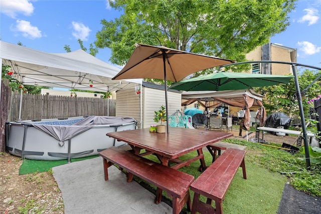 2719 Hering Ave, Bronx, NY 10469 - view of patio / terrace featuring outdoor dining area, a storage unit, and area for grilling