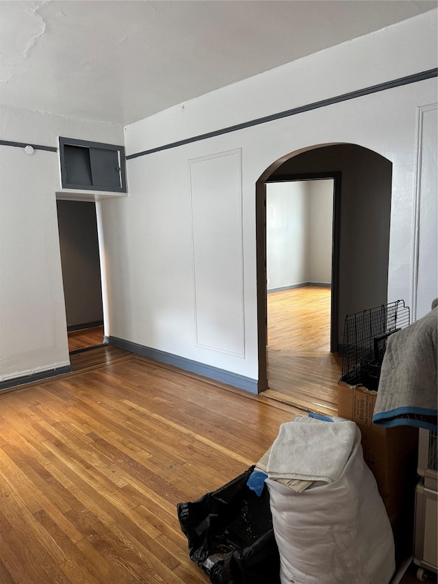 2922 Barnes Ave Unit 3A, Bronx, NY 10467 - unfurnished bedroom with arched walkways and wood finished floors