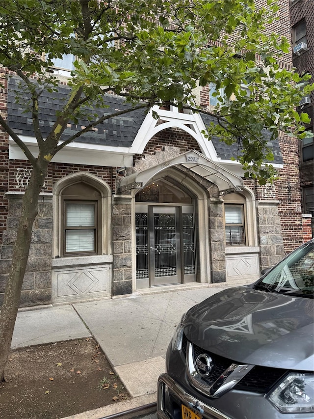 2922 Barnes Ave Unit 3A, Bronx, NY 10467 - entrance to property featuring brick siding and a shingled roof