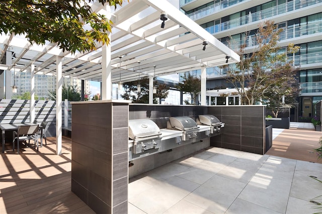 13101 40th Rd Unit 12M, Flushing, NY 11354 - view of patio with area for grilling and a pergola