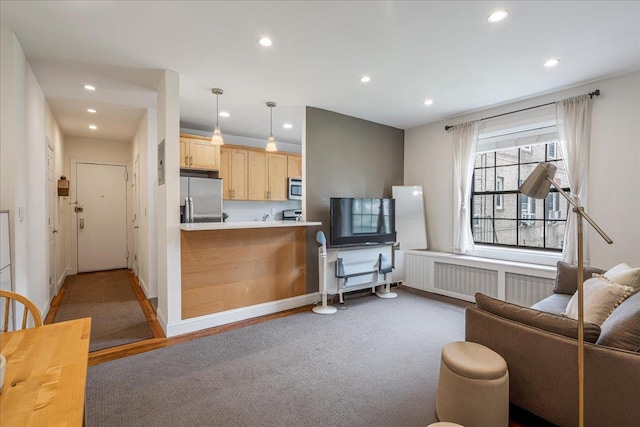 30-69 Hobart St Unit 2P, Woodside, NY 11377 - living area with radiator and recessed lighting