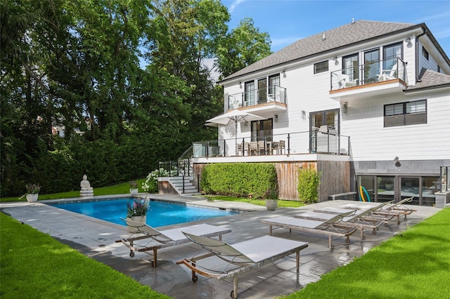 5 Kings Ln, Southampton, NY 11968 - outdoor pool with stairs, a patio area, and a lawn
