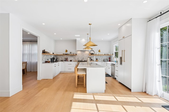 5 Kings Ln, Southampton, NY 11968 - kitchen with open shelves, tasteful backsplash, plenty of natural light, and recessed lighting