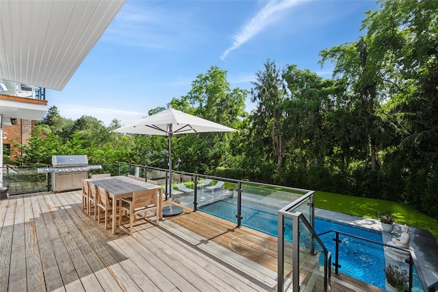5 Kings Ln, Southampton, NY 11968 - wooden terrace with outdoor dining space, an outdoor pool, grilling area, and view of scattered trees