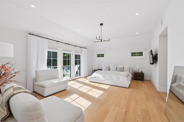 5 Kings Ln, Southampton, NY 11968 - bedroom with access to outside, light wood-style floors, a chandelier, and recessed lighting