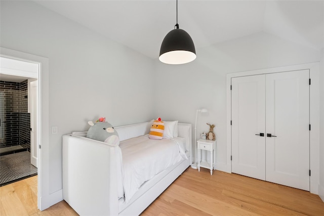 5 Kings Ln, Southampton, NY 11968 - bedroom with light wood-type flooring and a closet