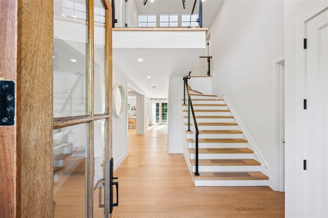 5 Kings Ln, Southampton, NY 11968 - foyer with a high ceiling, light wood-style flooring, stairway, and recessed lighting