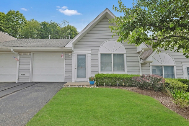 30 Windsor Cir Unit 30, New City, NY 10956 - view of front of home with an attached garage, a front yard, and asphalt driveway