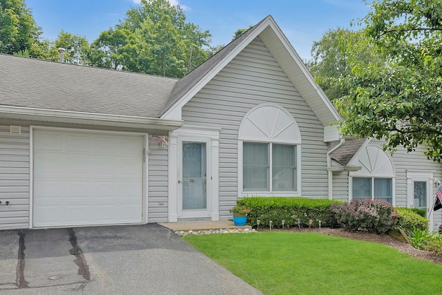 30 Windsor Cir Unit 30, New City, NY 10956 - view of front facade with a front yard, roof with shingles, an attached garage, and asphalt driveway