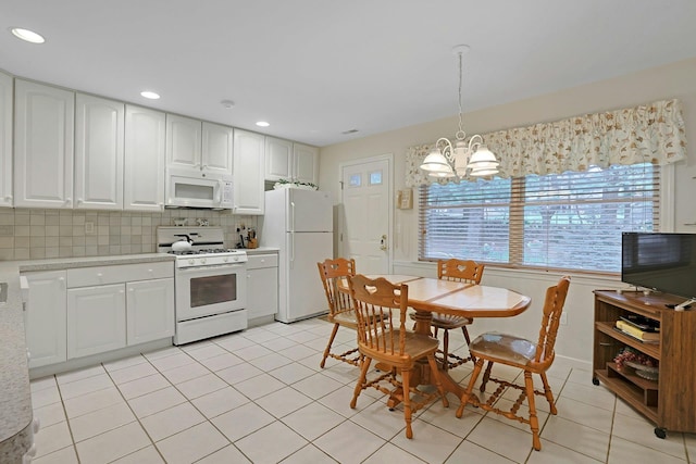 30 Windsor Cir Unit 30, New City, NY 10956 - kitchen with white appliances, light countertops, a chandelier, white cabinets, and recessed lighting