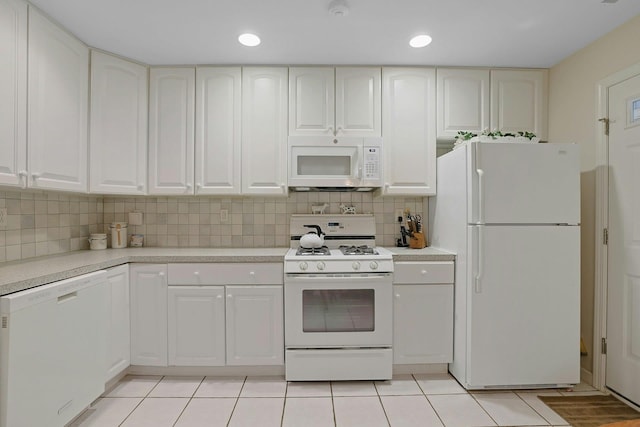 30 Windsor Cir Unit 30, New City, NY 10956 - kitchen with white appliances, light countertops, decorative backsplash, light tile patterned floors, and white cabinetry