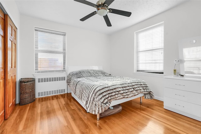 139-09 28th Rd Unit 6F, Flushing, NY 11354 - bedroom with radiator, hardwood / wood-style flooring, and a ceiling fan