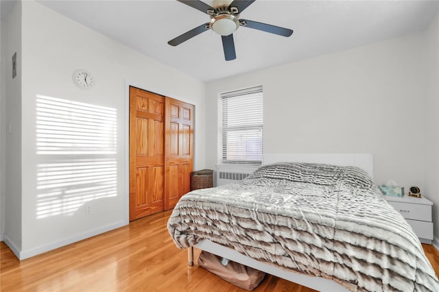139-09 28th Rd Unit 6F, Flushing, NY 11354 - bedroom featuring light wood-style flooring, radiator, a ceiling fan, and a closet