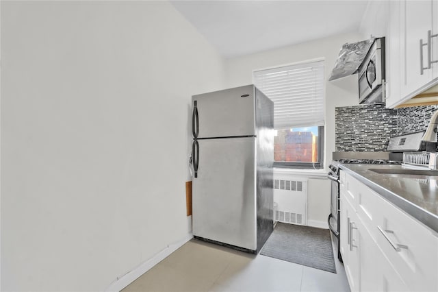 139-09 28th Rd Unit 6F, Flushing, NY 11354 - kitchen with appliances with stainless steel finishes, radiator heating unit, backsplash, and white cabinetry