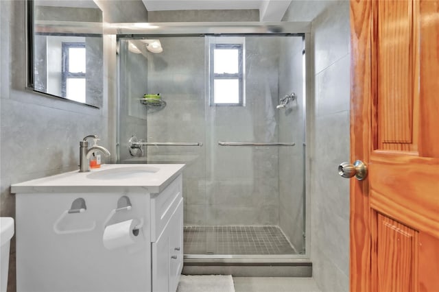 139-09 28th Rd Unit 6F, Flushing, NY 11354 - bathroom with vanity, a stall shower, and tile walls