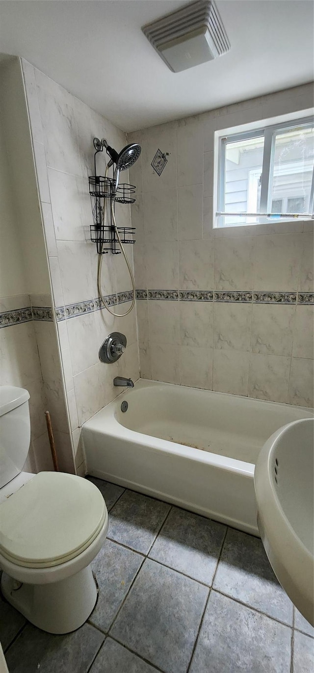344 Elm Rd W, Mastic Beach, NY 11951 - bathroom featuring tile patterned flooring, washtub / shower combination, and tile walls