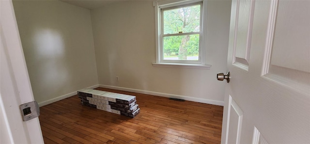 344 Elm Rd W, Mastic Beach, NY 11951 - spare room with wood-type flooring and baseboards