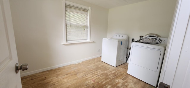 344 Elm Rd W, Mastic Beach, NY 11951 - laundry room with washing machine and dryer and light wood-type flooring