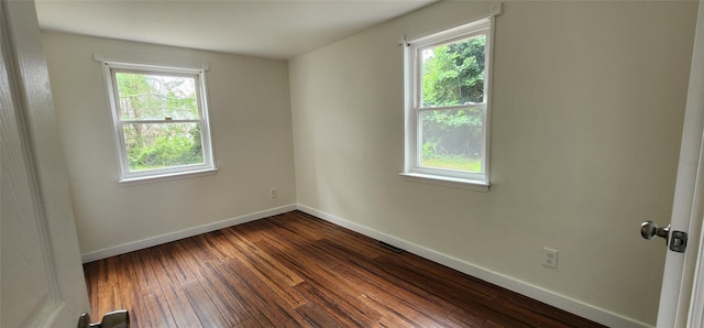 344 Elm Rd W, Mastic Beach, NY 11951 - empty room featuring plenty of natural light and dark wood-style floors