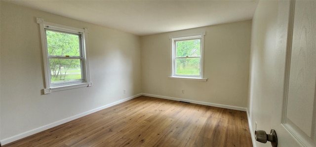 344 Elm Rd W, Mastic Beach, NY 11951 - unfurnished room with baseboards and wood-type flooring