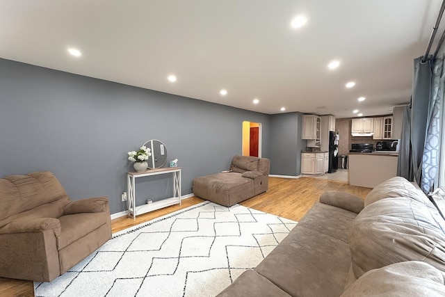 61 Ulster Ave, West Babylon, NY 11704 - living room with recessed lighting and light wood-style floors
