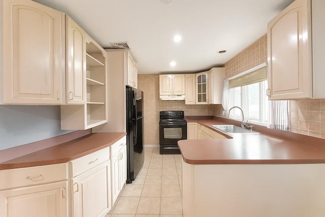 61 Ulster Ave, West Babylon, NY 11704 - kitchen featuring black appliances, open shelves, under cabinet range hood, a peninsula, and light tile patterned floors
