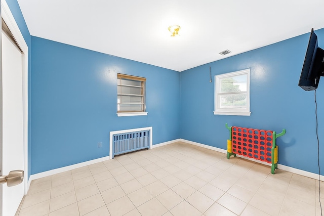 61 Ulster Ave, West Babylon, NY 11704 - empty room featuring radiator and baseboards