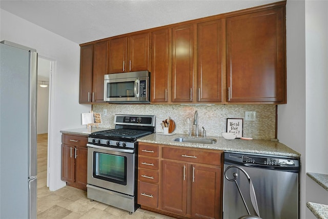 3333 Henry Hudson Pkwy W Unit 4M, Bronx, NY 10463 - kitchen with appliances with stainless steel finishes, decorative backsplash, and light stone counters