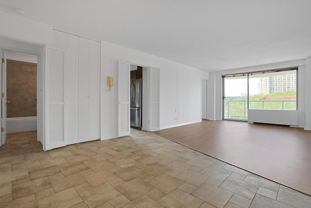 3333 Henry Hudson Pkwy W Unit 4M, Bronx, NY 10463 - unfurnished room featuring stone finish flooring and a smoke detector