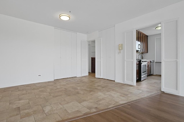 3333 Henry Hudson Pkwy W Unit 4M, Bronx, NY 10463 - empty room with stone finish flooring and baseboards