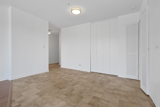 3333 Henry Hudson Pkwy W Unit 4M, Bronx, NY 10463 - unfurnished bedroom with stone finish floors and a closet