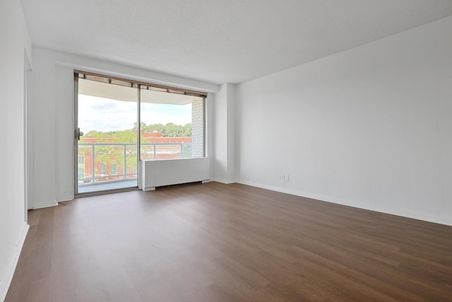 3333 Henry Hudson Pkwy W Unit 4M, Bronx, NY 10463 - empty room with radiator heating unit and wood finished floors