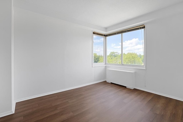 3333 Henry Hudson Pkwy W Unit 4M, Bronx, NY 10463 - unfurnished room with radiator and dark wood-style floors