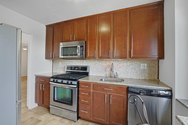 3333 Henry Hudson Pkwy W Unit 4M, Bronx, NY 10463 - kitchen featuring appliances with stainless steel finishes, tasteful backsplash, and light stone countertops
