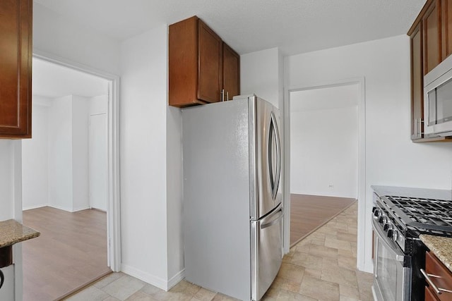3333 Henry Hudson Pkwy W Unit 4M, Bronx, NY 10463 - kitchen with appliances with stainless steel finishes and light stone countertops