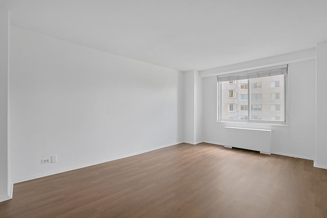3333 Henry Hudson Pkwy W Unit 4M, Bronx, NY 10463 - empty room with radiator heating unit and wood finished floors