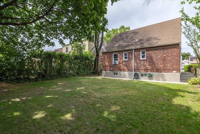 22324 Murdock Ave, Queens Village, NY 11429 - rear view of house with brick siding and roof with shingles
