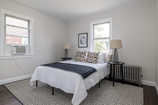 22324 Murdock Ave, Queens Village, NY 11429 - bedroom featuring radiator, wood finished floors, cooling unit, and crown molding