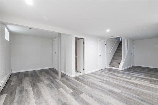 22324 Murdock Ave, Queens Village, NY 11429 - finished below grade area featuring baseboard heating, stairway, wood finished floors, and recessed lighting