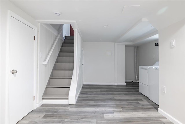 22324 Murdock Ave, Queens Village, NY 11429 - staircase with washing machine and dryer and wood finished floors