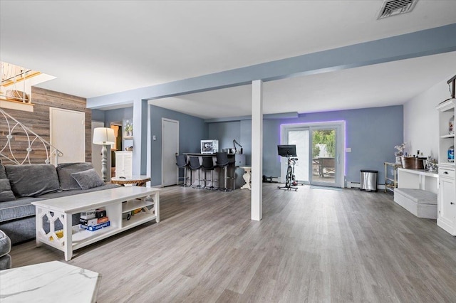 25 Amapola Ln, Kings Park, NY 11754 - living area featuring wood walls and light wood finished floors