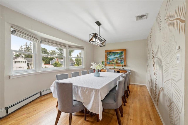 25 Amapola Ln, Kings Park, NY 11754 - dining area with baseboard heating and light wood-type flooring