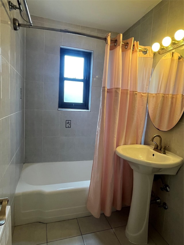 90-32 153rd Ave Unit 0029, Howard Beach, NY 11414 - bathroom with tile patterned flooring, shower / bathtub combination with curtain, and tile walls