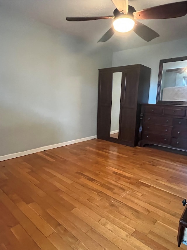 90-32 153rd Ave Unit 0029, Howard Beach, NY 11414 - unfurnished bedroom with hardwood / wood-style floors and a ceiling fan